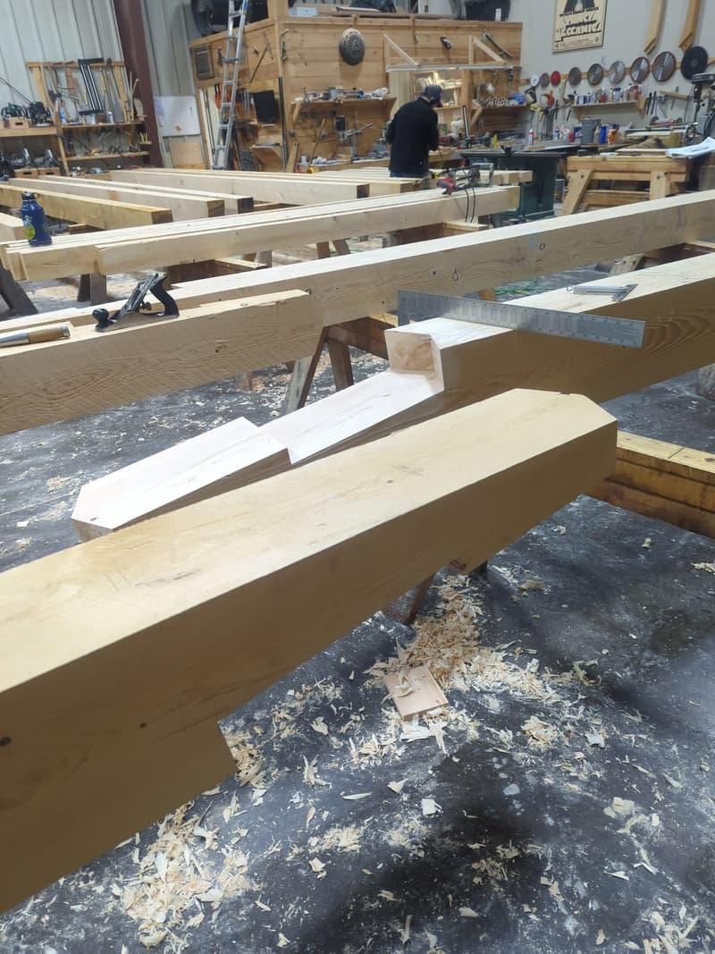 Traditional scarf joint with wooden keys being fit in the South Paris timber shop